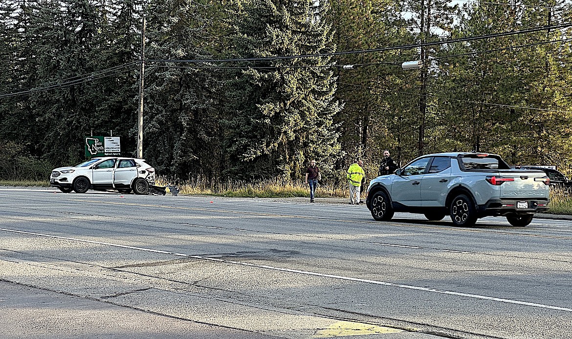 Lincoln County first responders work Thursday, Sept. 19, 2024, at the scene of a traffic accident on U.S. 2 near Saverite South in Libby. (Taylor Resch/The Western News)