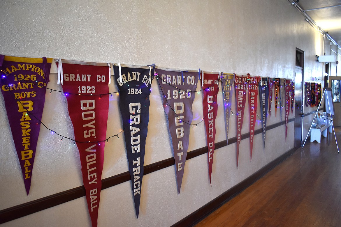 The main hallway of the former Hartline School reflects its past glory with pennants commemorating the school’s victories over the years.