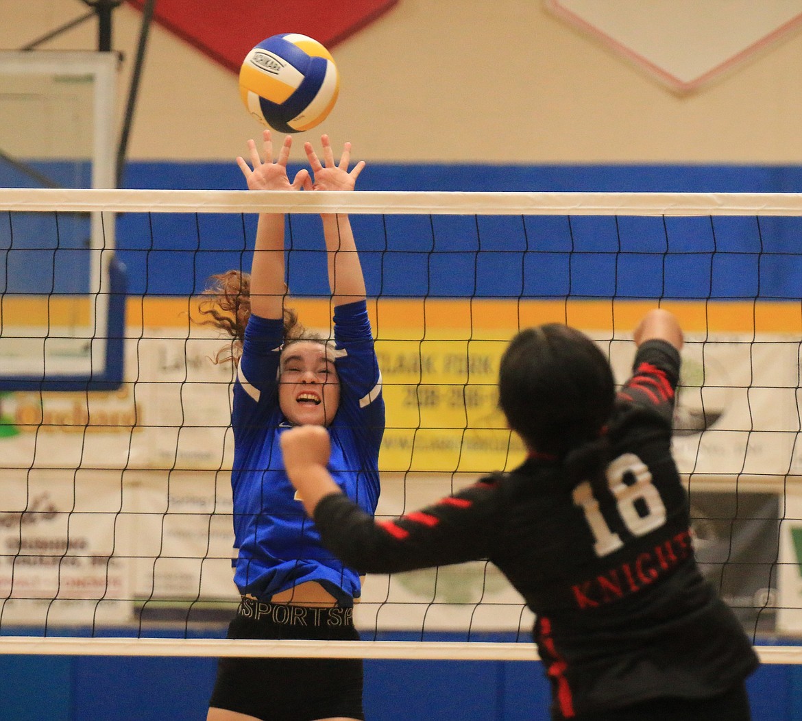 Clark Fork High senior pin hitter Hannah Thompson looks to block a Lakeside attacker during Thursday night's match.