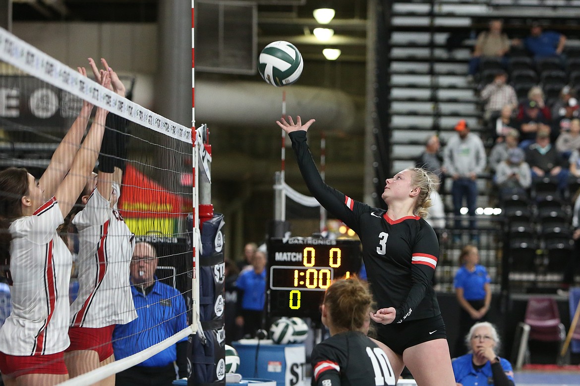 Lind-Ritzville/Sprague senior Addy Colbert goes up to tip the ball over the net during a game against Coupeville at last year’s state tournament.