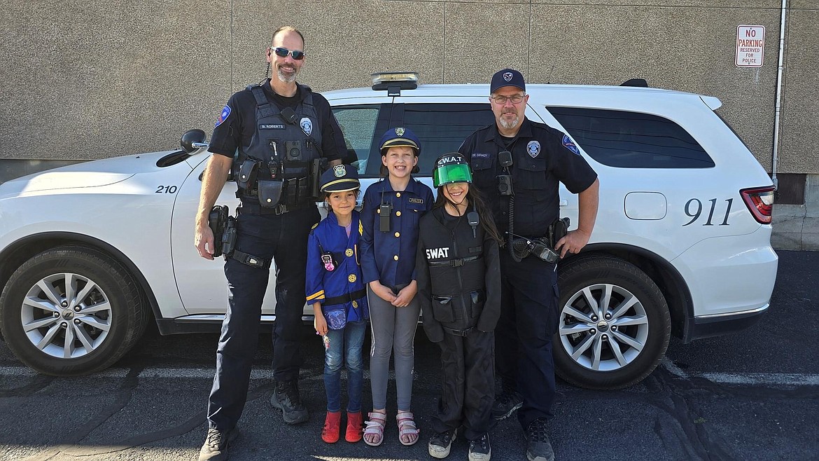 The Ephrata Police Department officers posed with three young ladies in patrol gear Sept. 14.