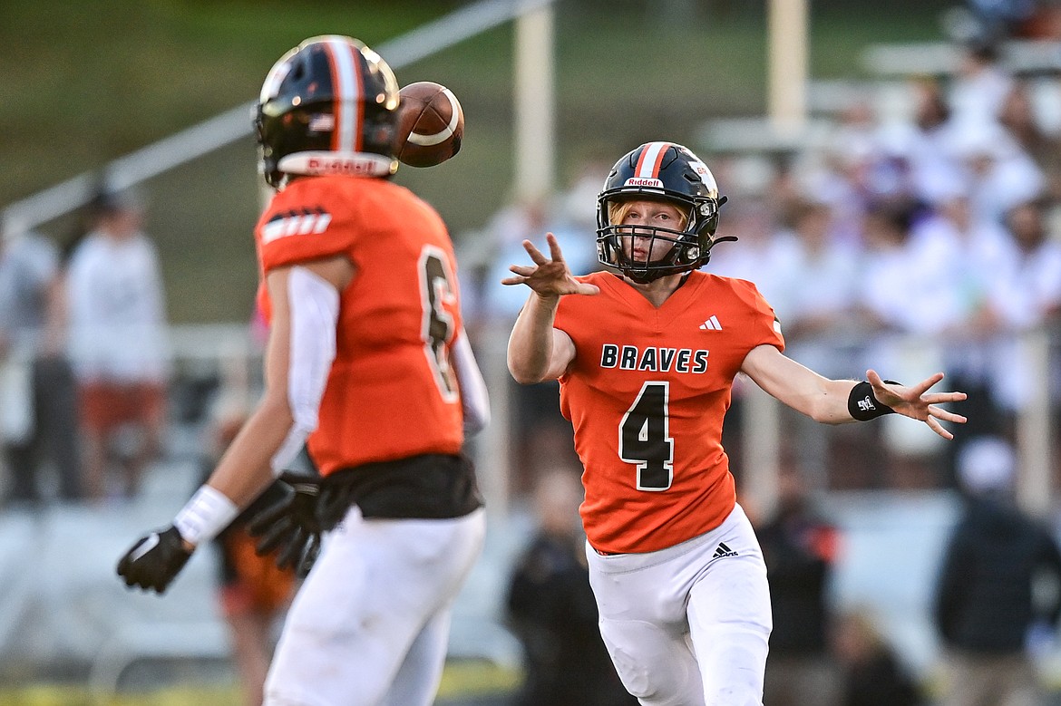 Flathead quarterback Brett Pesola (4) completes a pass to wide receiver Eli Coopman (6) in the first quarter against Missoula Sentinel at Legends Stadium on Friday, Sept. 20. (Casey Kreider/Daily Inter Lake)