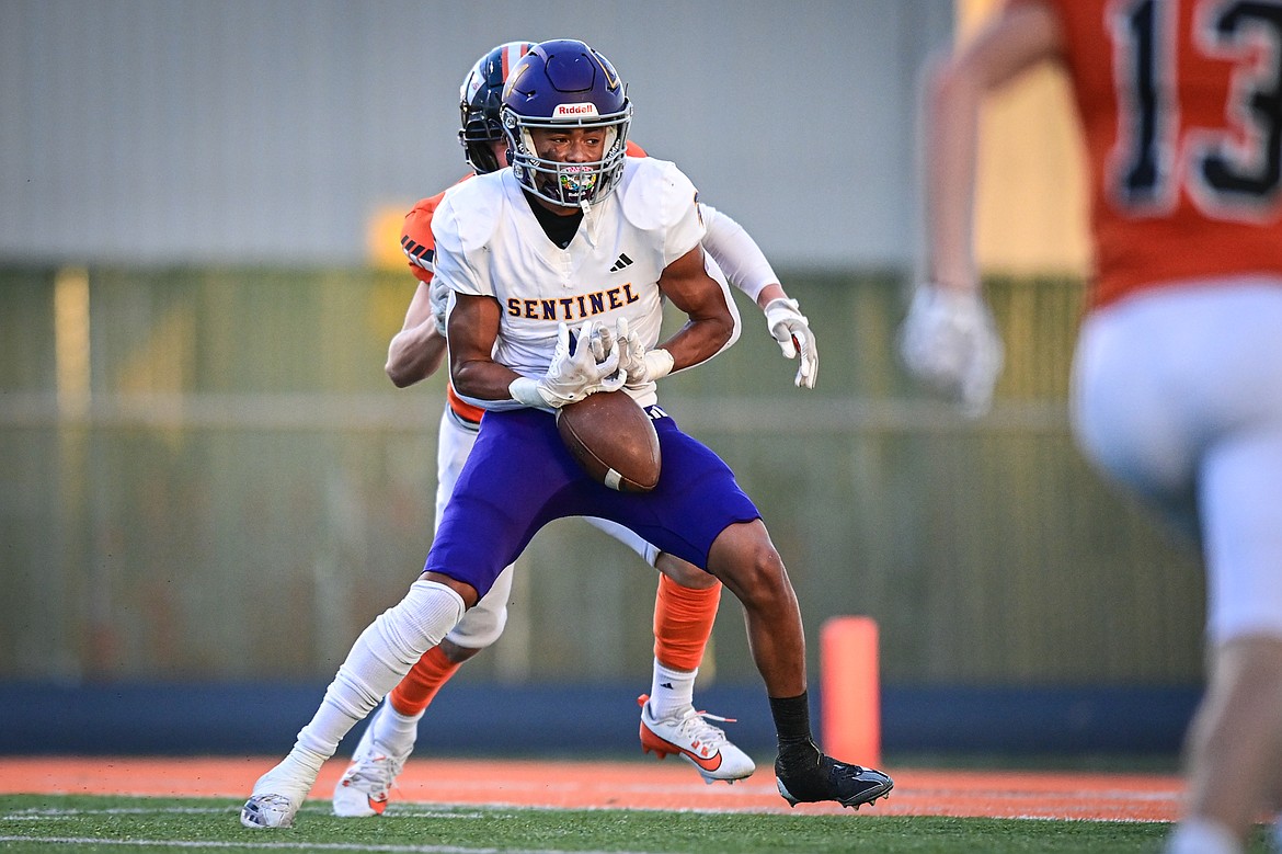 Missoula Sentinel wide receiver C.J. Hayhurst (1) holds on to a touchdown reception in the first quarter against Flathead at Legends Stadium on Friday, Sept. 20. (Casey Kreider/Daily Inter Lake)