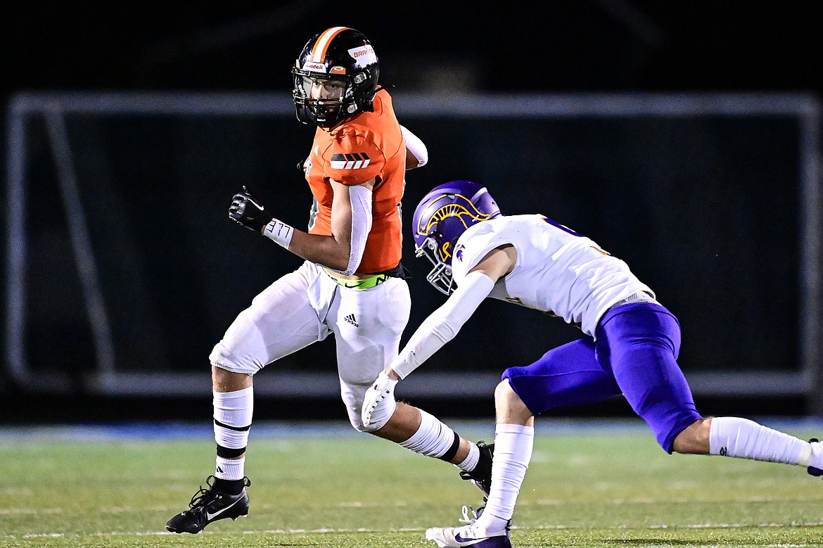 Flathead wide receiver Eli Coopman (6) picks up yardage on a reception in the third quarter against Missoula Sentinel at Legends Stadium on Friday, Sept. 20. (Casey Kreider/Daily Inter Lake)