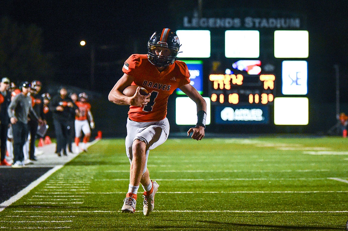 Flathead quarterback Brett Pesola (4) runs for a touchdown in the third quarter against Missoula Sentinel at Legends Stadium on Friday, Sept. 20. (Casey Kreider/Daily Inter Lake)