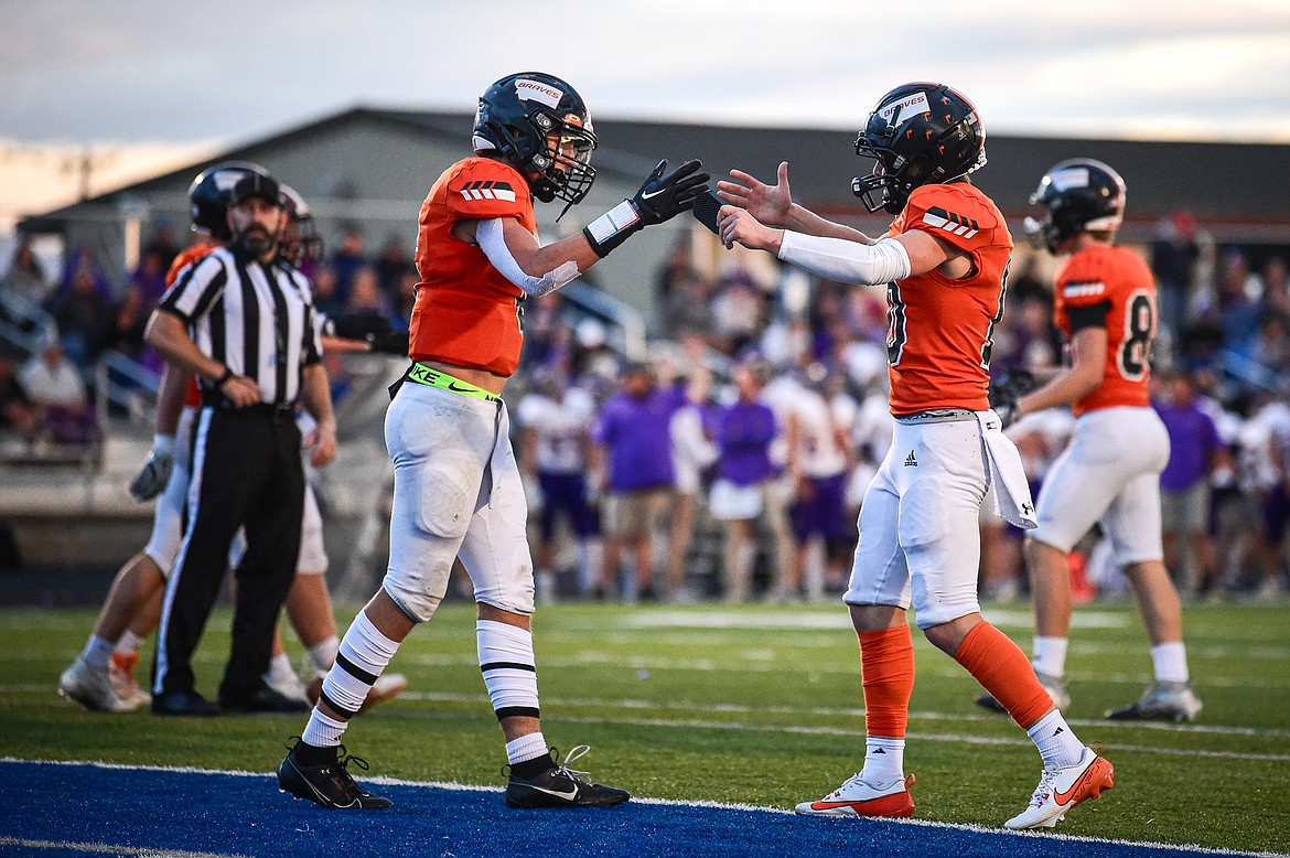 Flathead wide receivers Eli Coopman (6) and Brandon Holzer (10) celebrate after Coopman's touchdown reception in the first quarter against Missoula Sentinel at Legends Stadium on Friday, Sept. 20. (Casey Kreider/Daily Inter Lake)