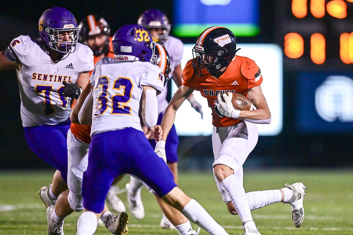 Flathead wide receiver Noah Sonju (8) picks up yardage after a reception in the third quarter against Missoula Sentinel at Legends Stadium on Friday, Sept. 20. (Casey Kreider/Daily Inter Lake)