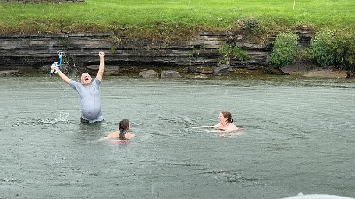 Ben Bruso cheers on the shore in Ogdensburg, New York after swimming across the Saint Lawrence River. (Courtesy photo)