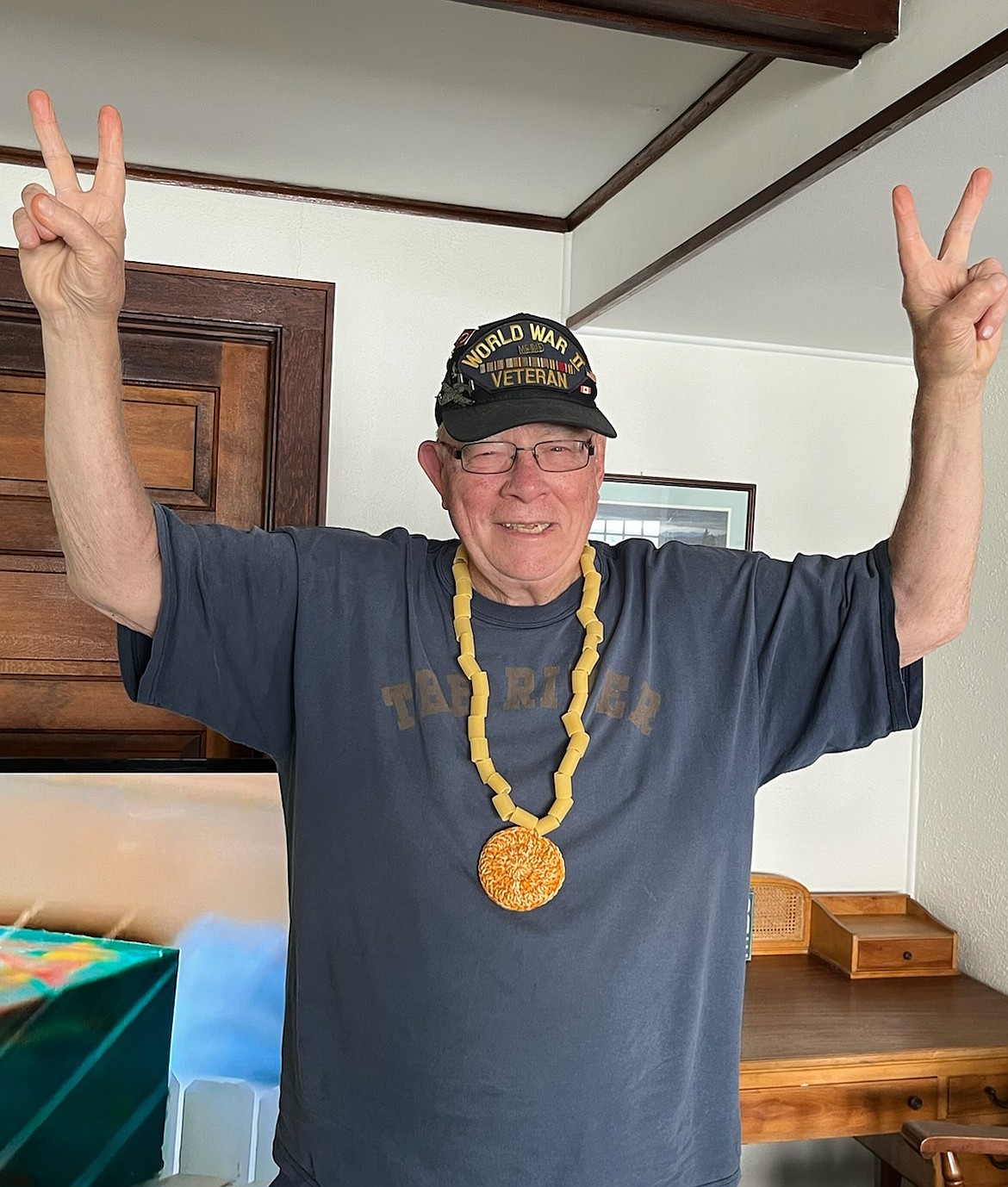 Ben Bruso poses with a homemade gold medal after swimming across the Saint Lawrence River in New York. (Courtesy photo)