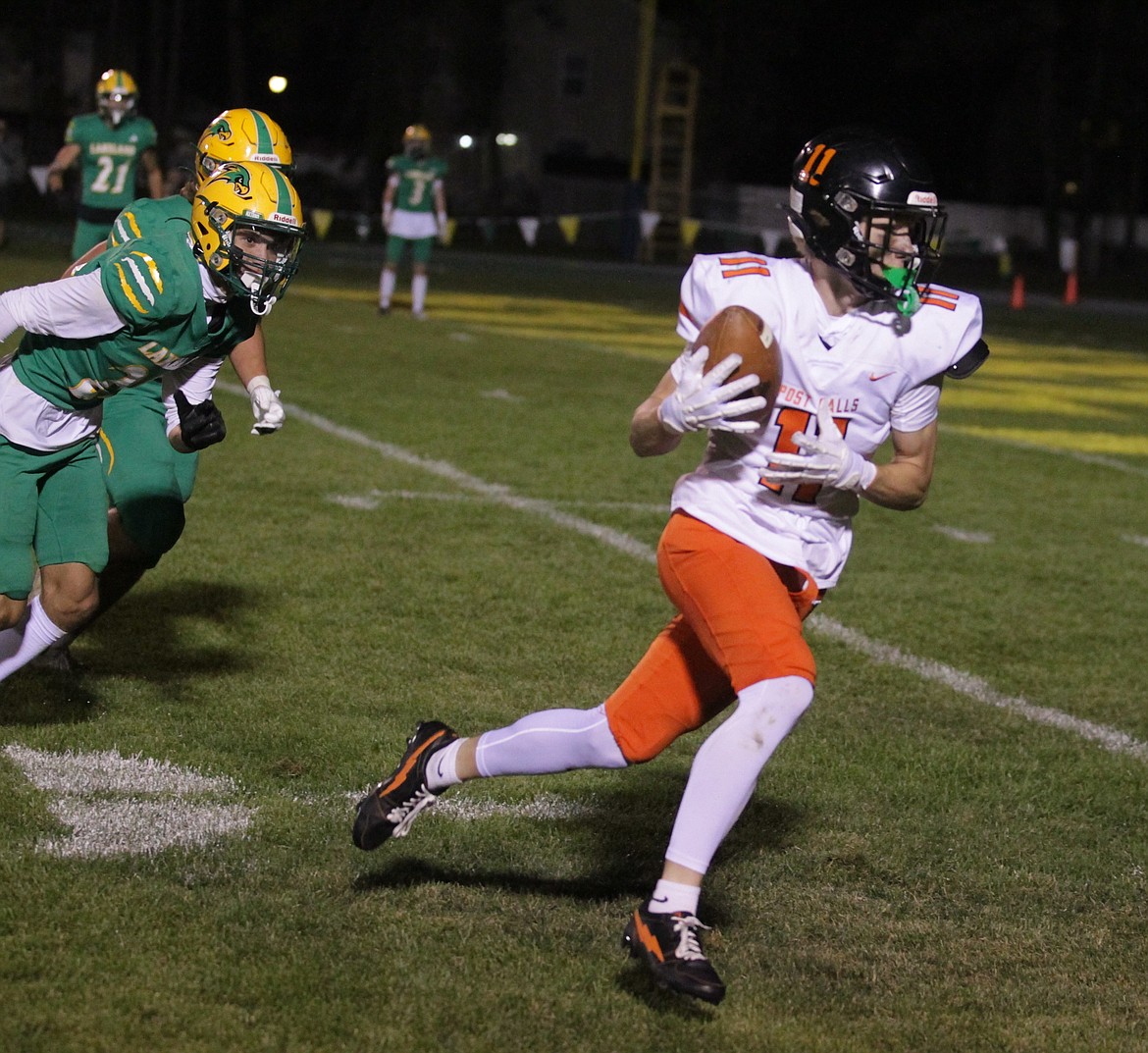 JASON ELLIOTT/Press
Post Falls sophomore wide receiver Cody Mathews scores on a 15-yard touchdown pass to give the Trojans the lead in the fourth quarter of Friday's game at Corbit Field in Rathdrum.