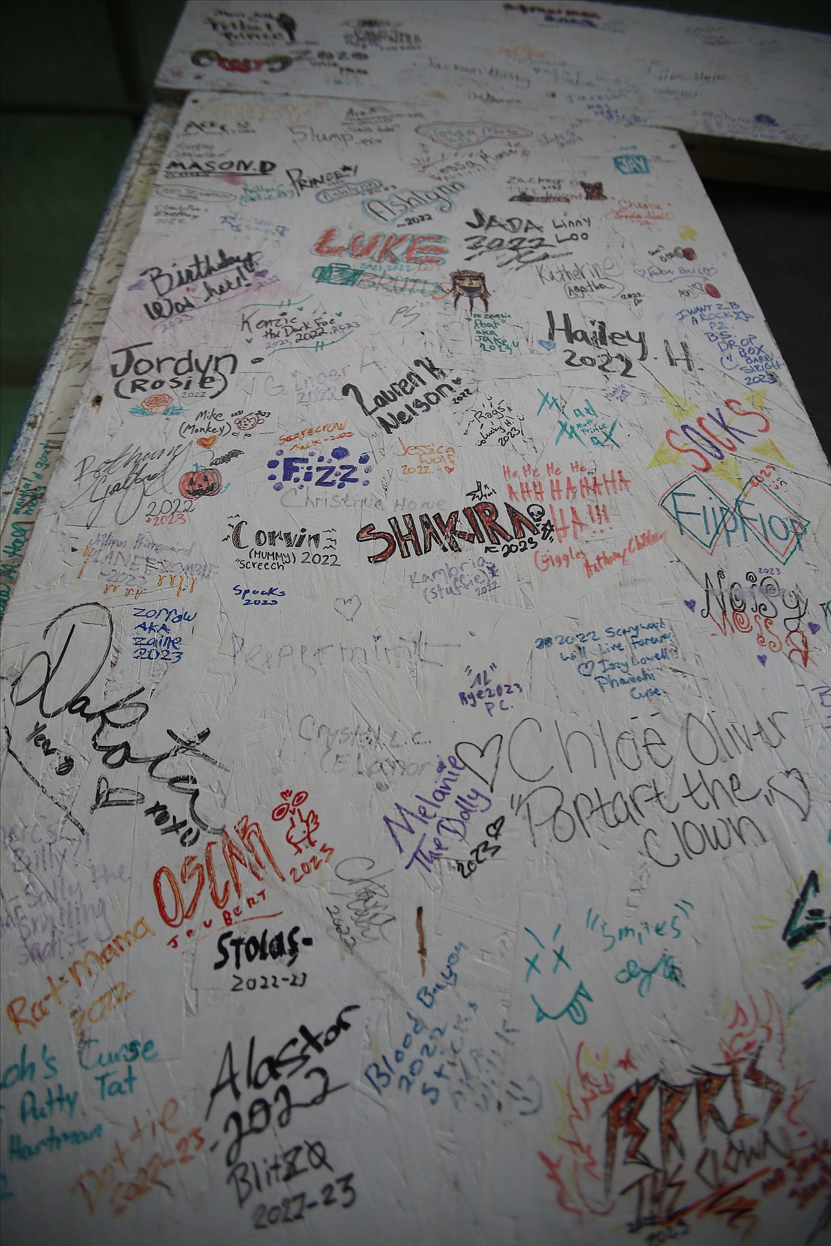 Actors have signed their names and character insignias on the dressing rooms at Scarywood for years.