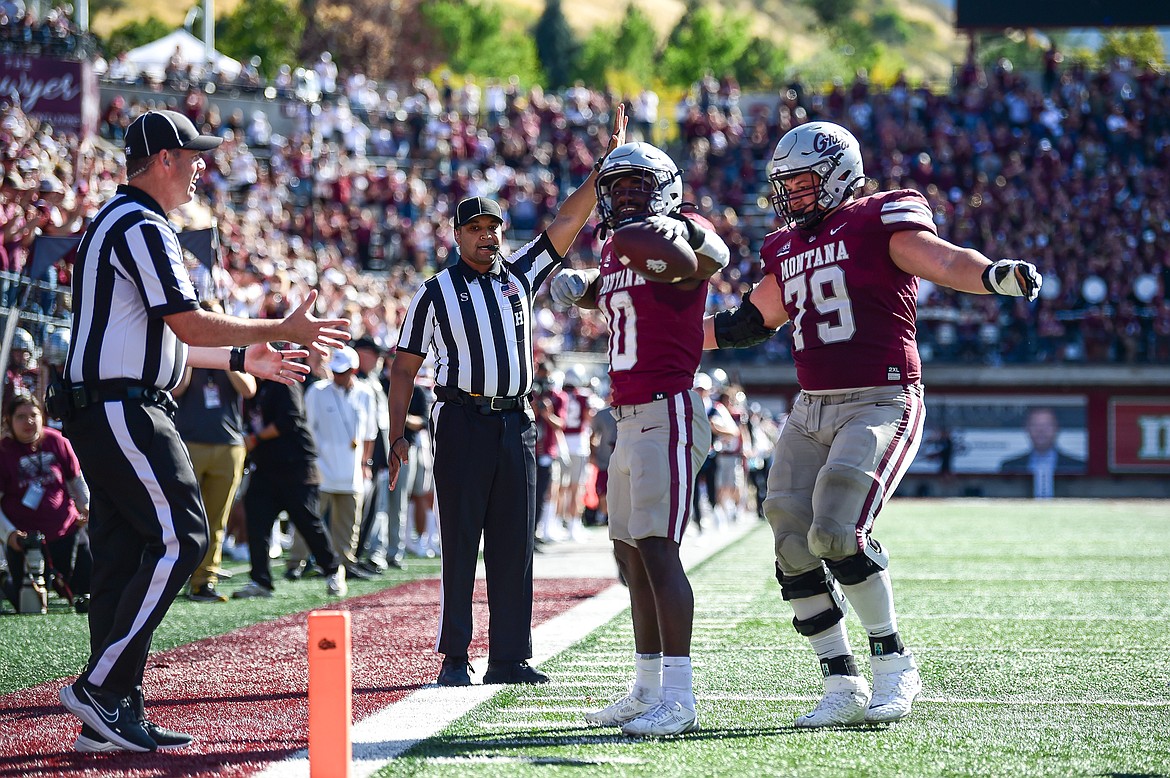 Grizzlies running back Eli Gillman (10) motions for a first down after a 58-yard run in the third quarter against Western Carolina at Washington-Grizzly Stadium on Saturday, Sept. 21. (Casey Kreider/Daily Inter Lake)