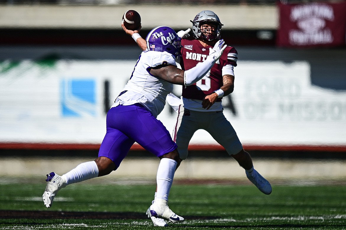 Grizzlies quarterback Keali'i Ah Yat (8) throws under pressure in the second quarter against Western Carolina at Washington-Grizzly Stadium on Saturday, Sept. 21. (Casey Kreider/Daily Inter Lake)