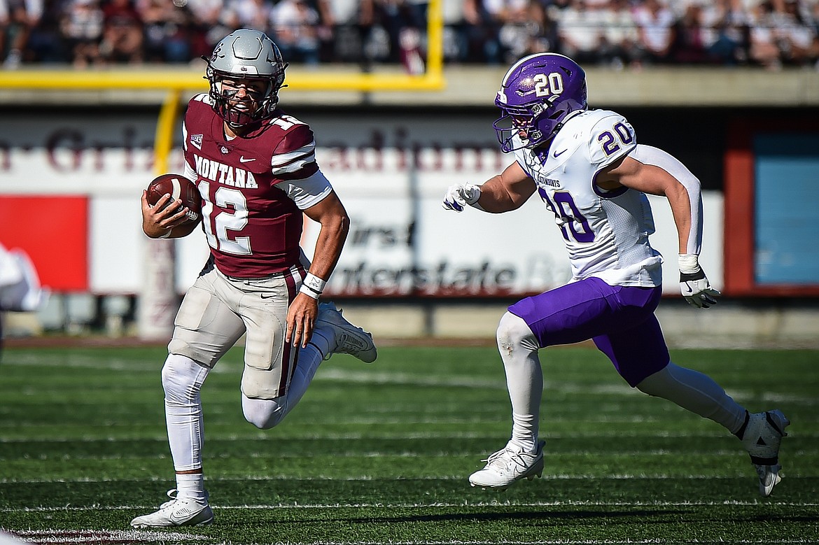 Grizzlies quarterback Logan Fife looks for running room in the fourth quarter against Western Carolina at Washington-Grizzly Stadium on Saturday, Sept. 21. (Casey Kreider/Daily Inter Lake)