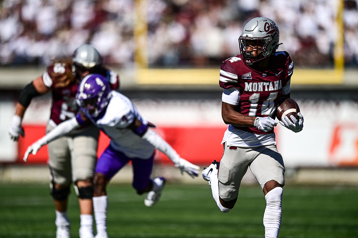 Grizzlies wide receiver Aaron Fontes (14) breaks a 29-yard run in the second quarter against Western Carolina at Washington-Grizzly Stadium on Saturday, Sept. 21. (Casey Kreider/Daily Inter Lake)