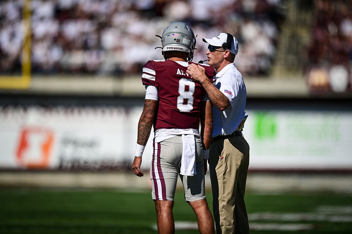 Grizzlies head coach Bobby Hauck speaks with quarterback Keali'i Ah Yat (8) in the second quarter against Western Carolina at Washington-Grizzly Stadium on Saturday, Sept. 21. (Casey Kreider/Daily Inter Lake)