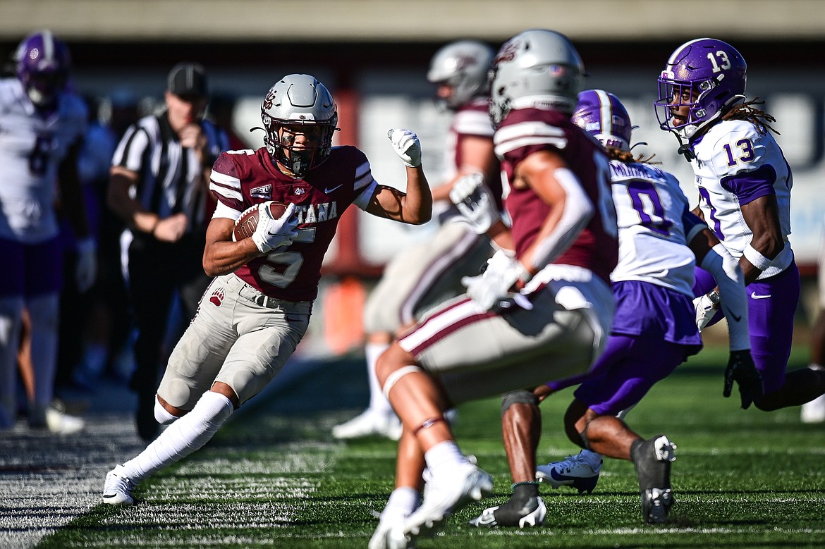 Grizzlies wide receiver Junior Bergen picks up yardage after a reception in the fourth quarter against Western Carolina at Washington-Grizzly Stadium on Saturday, Sept. 21. (Casey Kreider/Daily Inter Lake)