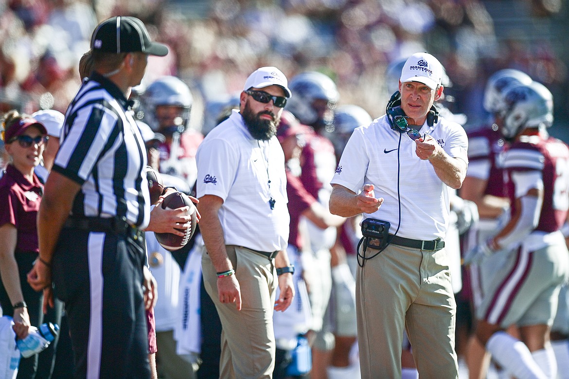 Grizzlies head coach Bobby Hauck offers a referee his glasses after an offensive play didn't draw a flag on the Western Carolina defense in the third quarter at Washington-Grizzly Stadium on Saturday, Sept. 21. (Casey Kreider/Daily Inter Lake)