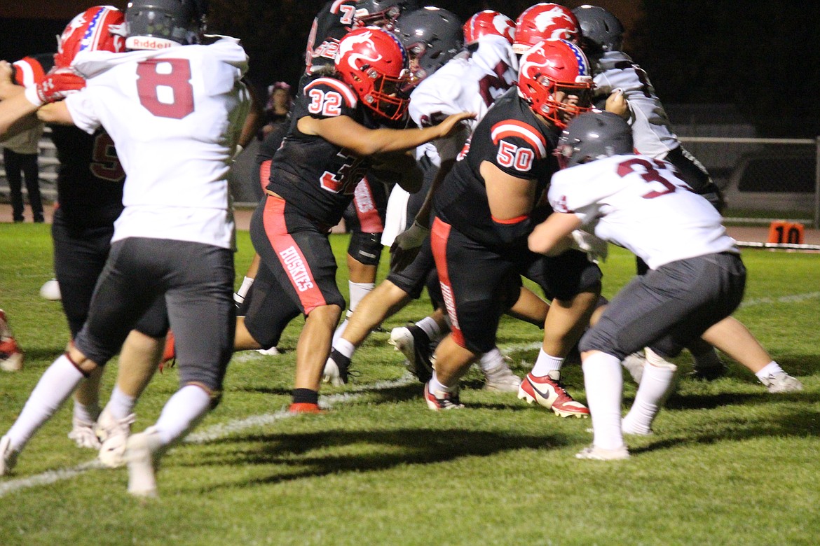 Jordan DeLeon (32) follows offensive lineman Mason Perez (50) downfield. DeLeon scored two touchdowns in the win, while Perez returned a fumble for a touchdown in the first quarter on defense.