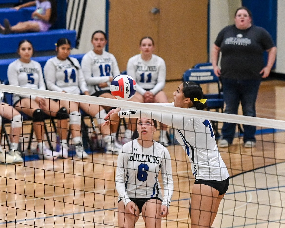 Mission's Cora Matt and Brooke Tanner at the net against Troy. (Christa Umphrey photo)