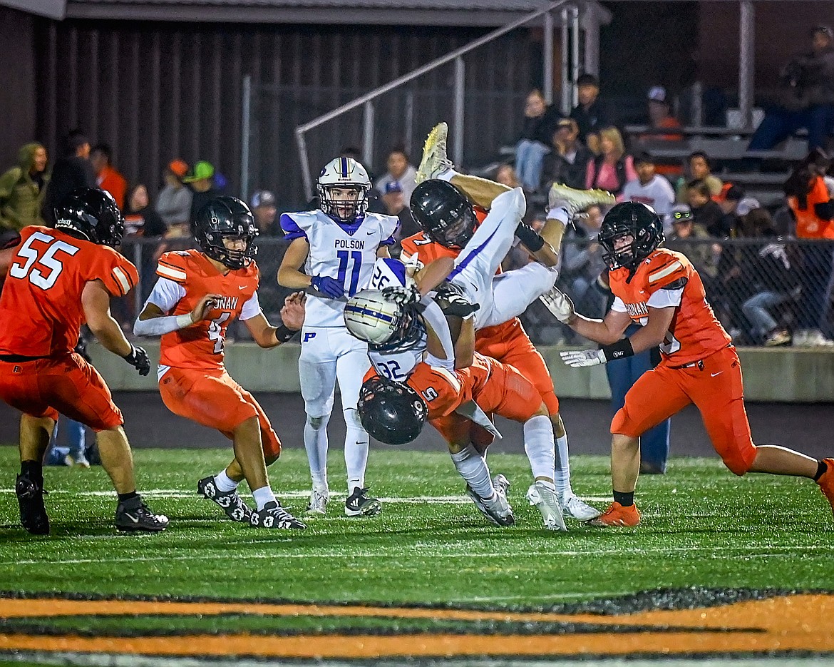 Polson's Daniel O'Roake gets tackled against Ronan. (Christa Umphrey photo)