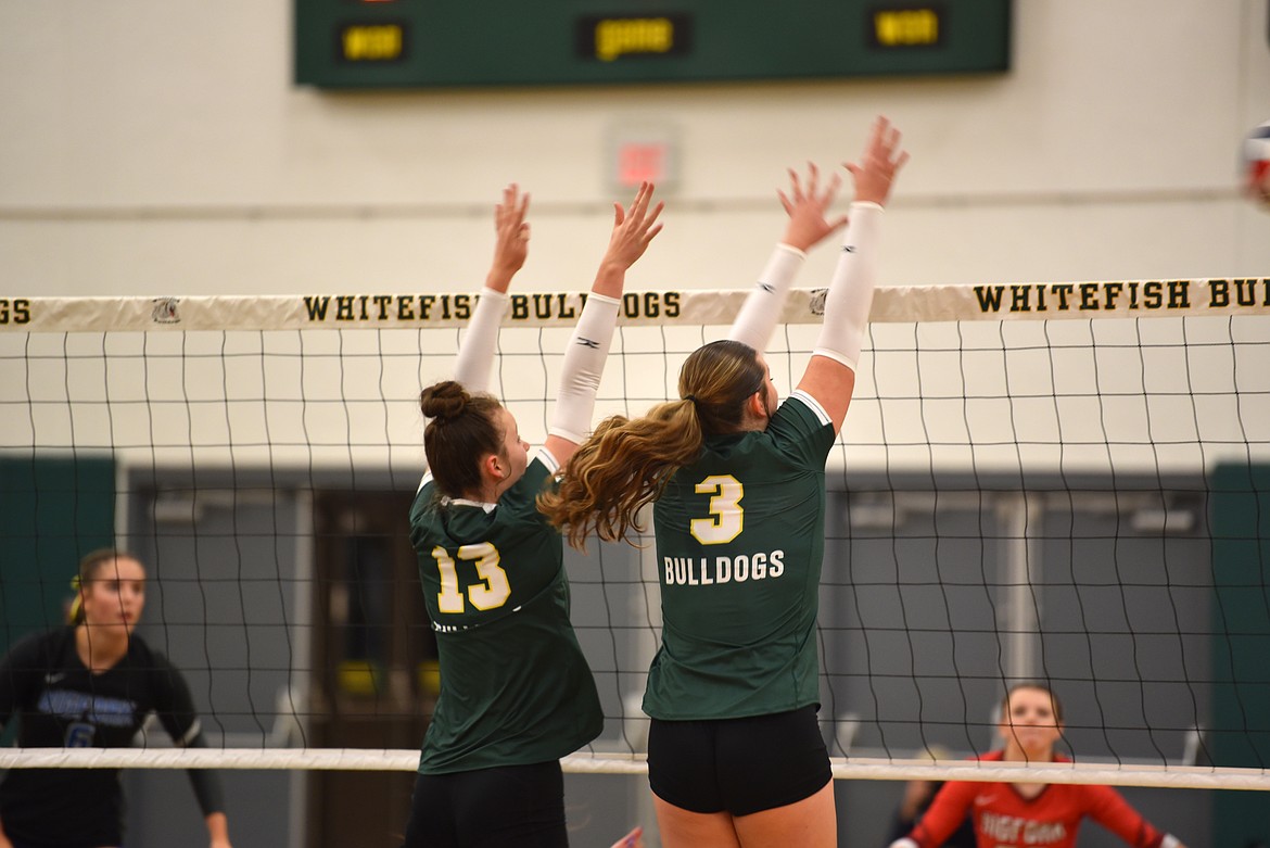 Freshman Stella Frisbee and junior Sol Holmquist at the Whitefish v. Bigfork varsity volleyball game Sept. 17. (Kelsey Evans/Whitefish Pilot)