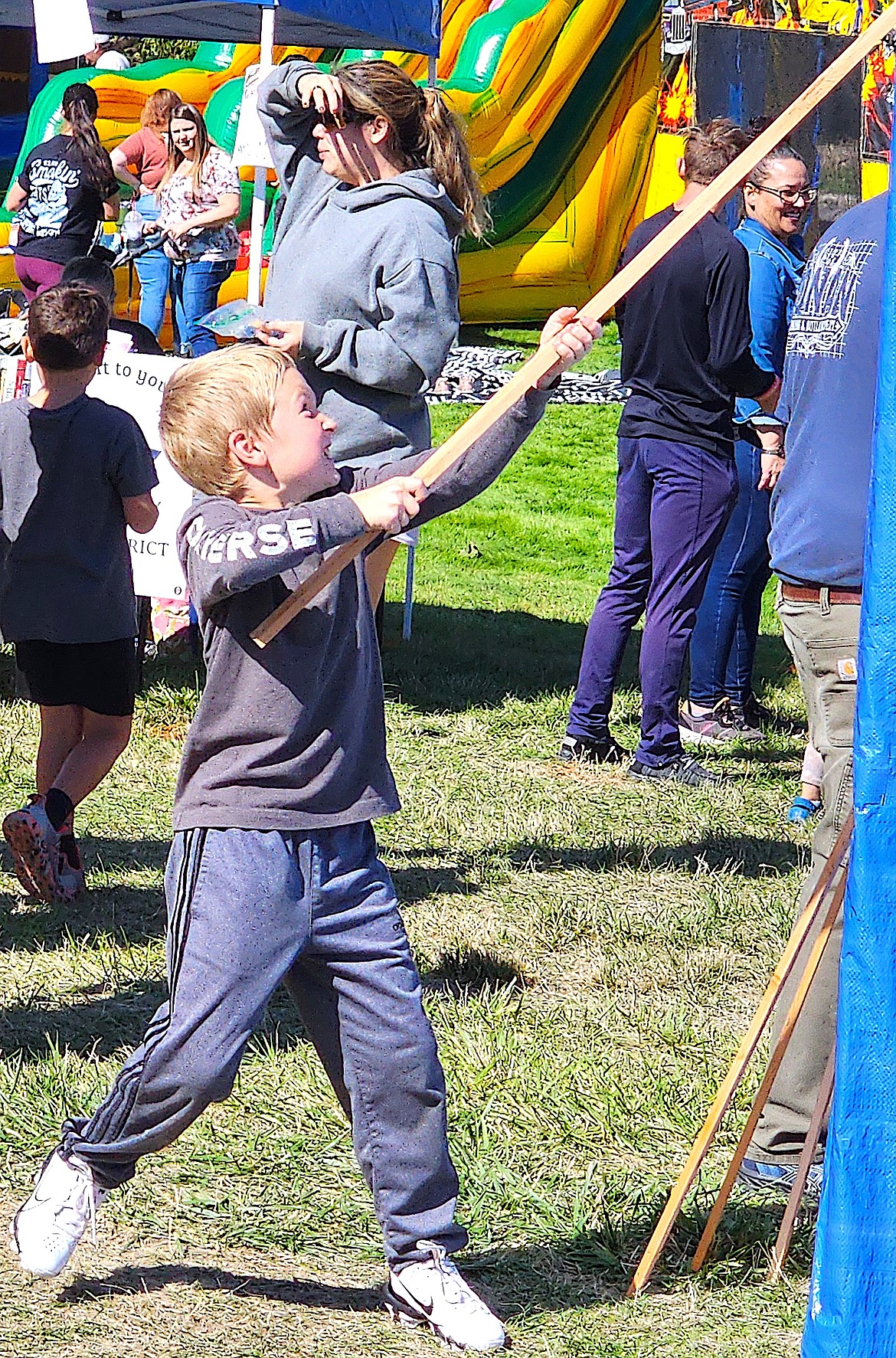 The fish pond at the Boy Scouts of America tent was very popular with kids, such as this young man. (Berl Tiskus/Leader)