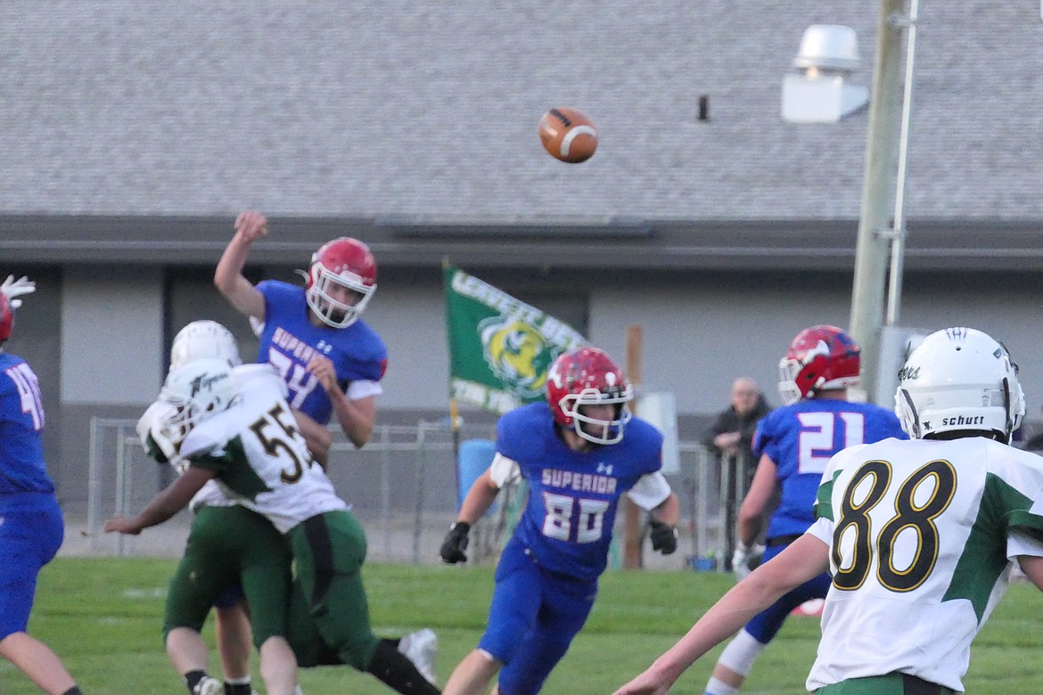 Superior sophomore quarterback (#14) is hit as he releases a pass during the Bobcats home game vs St. Regis this past week. (Chuck Bandel/VP-MI)