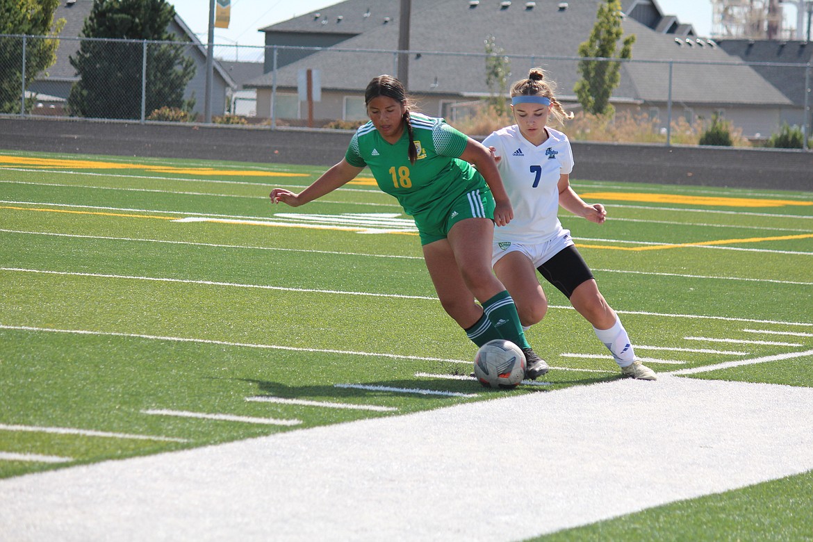 Quincy’s Gabriela Lopez (18) takes the ball from a Lakeside player in Saturday’s win.