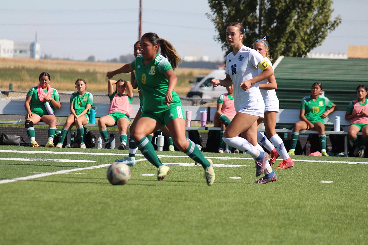 Crystal Vargas (9) pushes the ball upfield against the Lakeside defense.