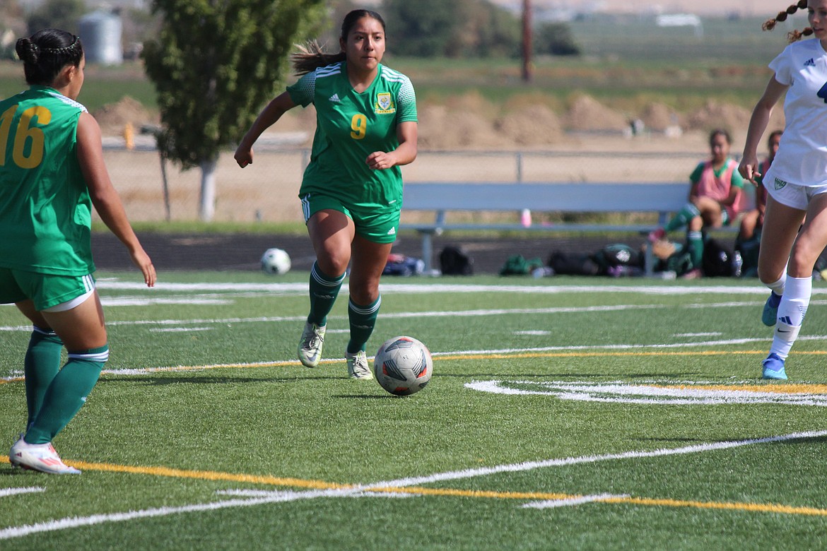 Crystal Vargas (9) works the ball through the Lakeside defense in Quincy’s win Saturday.