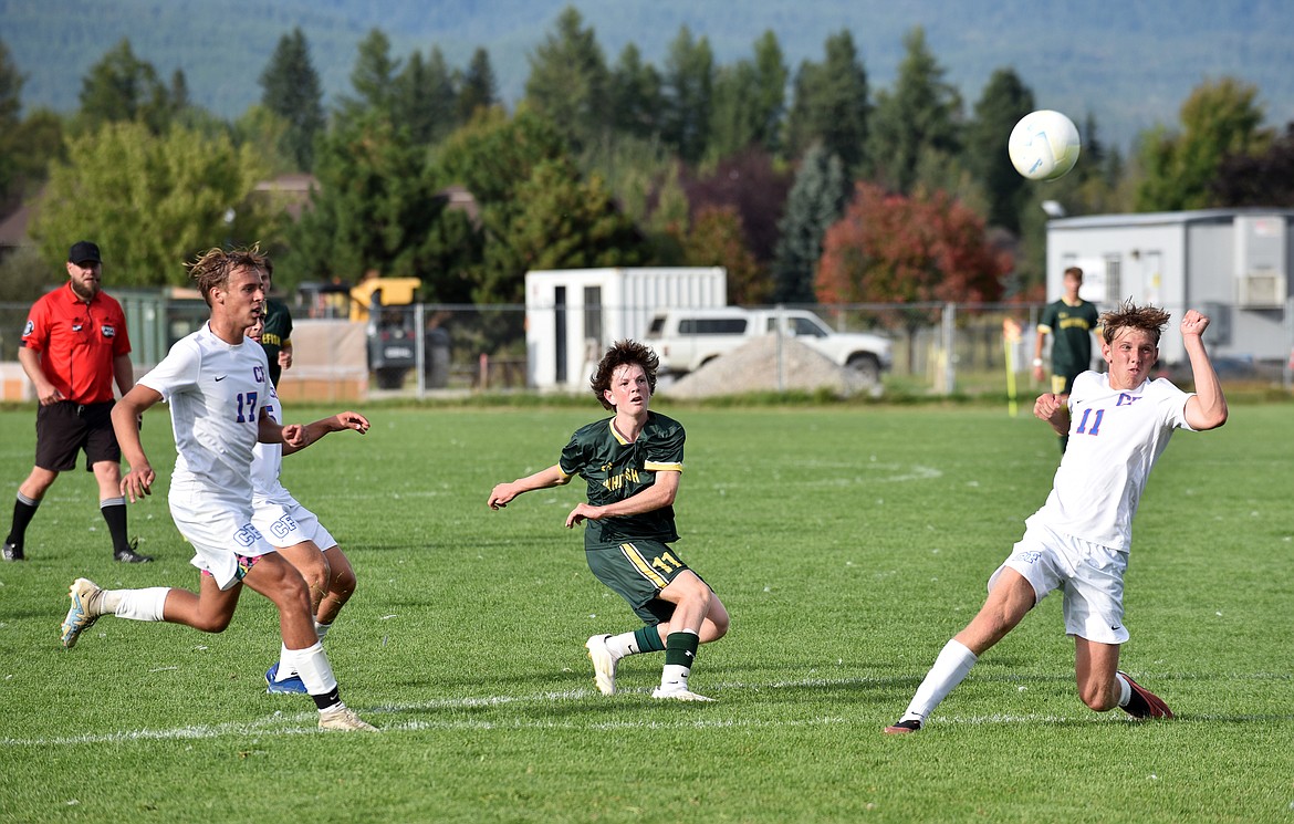 Bulldog Griffin Johnson sends a pass into the box. (Julie Engler/Whitefish Pilot)