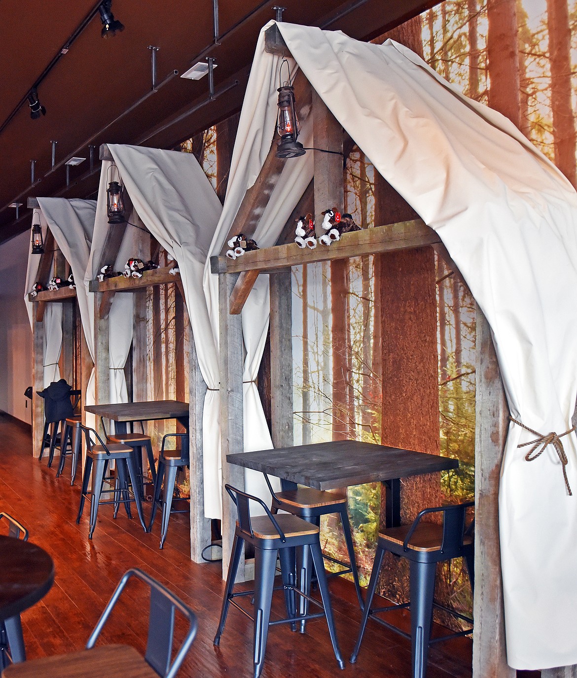 Fun, rustic tent seating lines one wall of the Clydesdale Creamery on Baker Avenue. (Julie Engler/Whitefish Pilot)