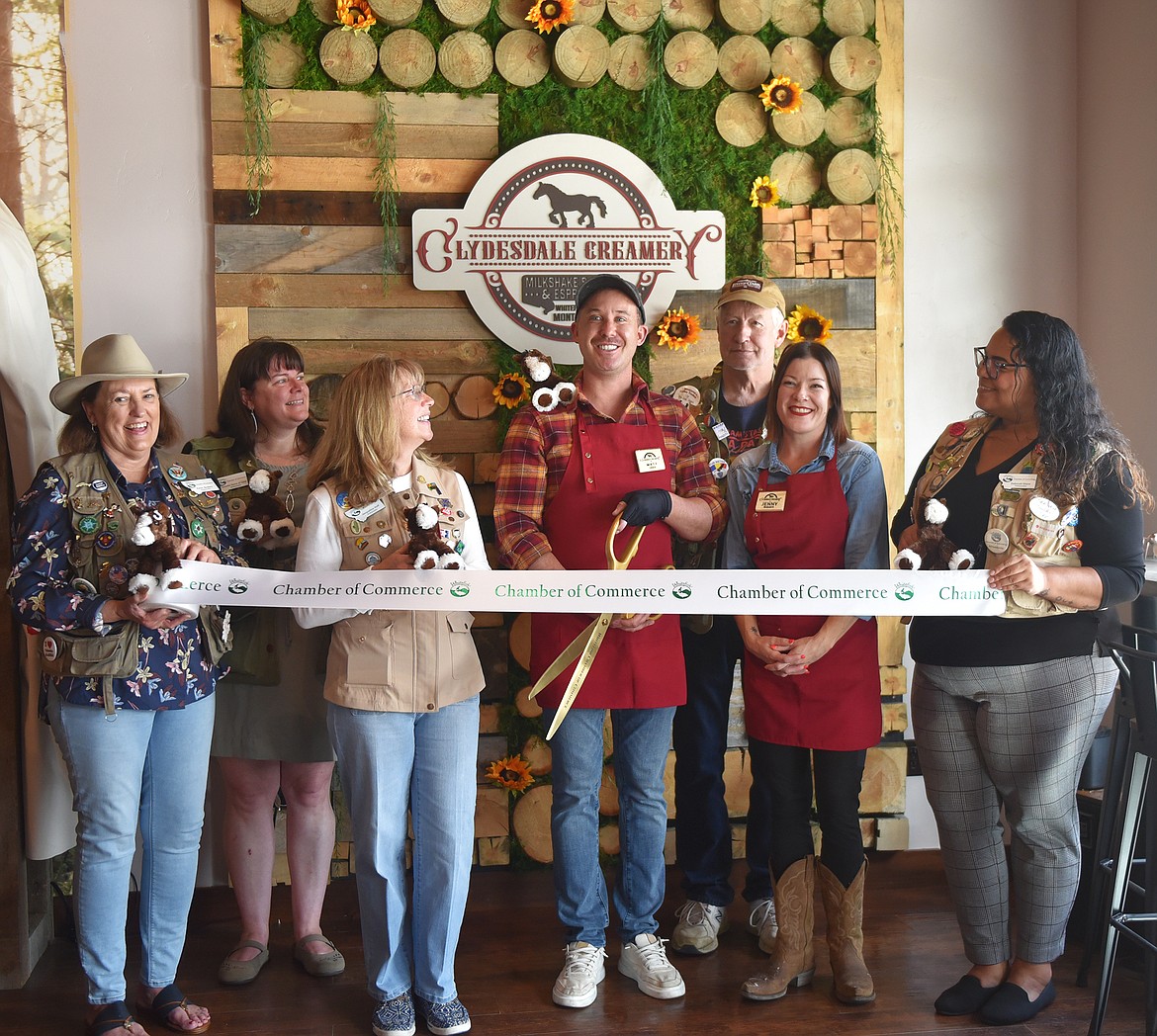 Owner Matt Arnold-Ladensack, manager Jenny Ingram, and Whitefish Chamber Ambassadors at the ribbon cutting ceremony for the Clydesdale Creamery on Baker Avenue. (Julie Engler/Whitefish Pilot)