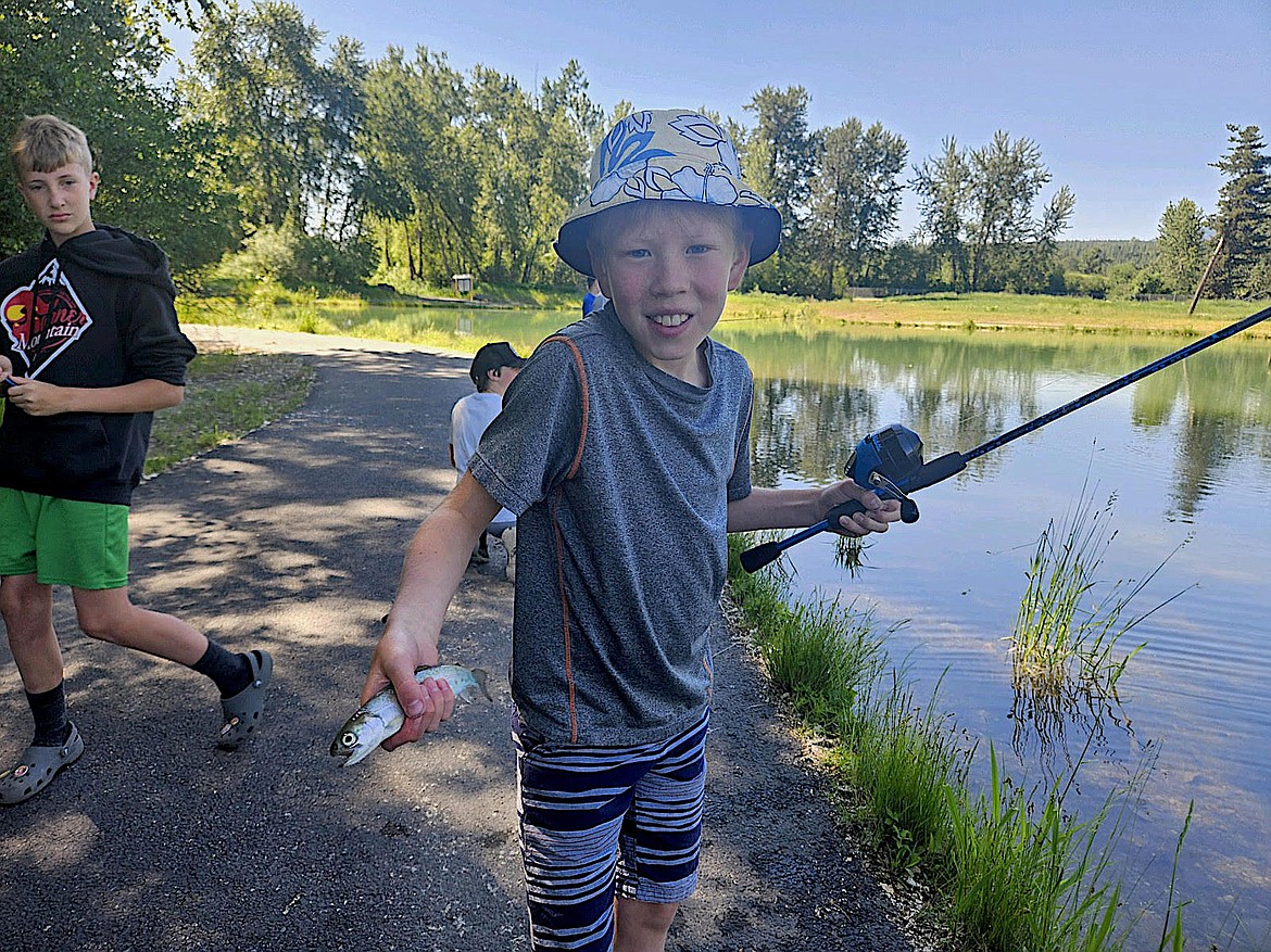 Members of the Kootenai Outdoor Adventure Program enjoyed catching trout at the Libby fish ponds in June. (Photo courtesy Bill Moe)