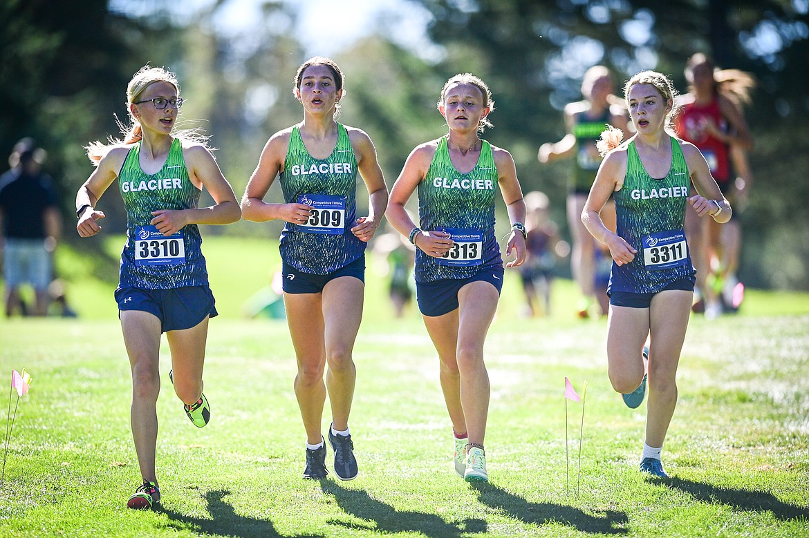 Glacier's Lauren Bissen, Dacia Benkleman, Miel Newton and Hailey Fiala run in the Whitefish Invitational at Whitefish Lake Golf Club on Tuesday, Sept. 24. (Casey Kreider/Daily Inter Lake)