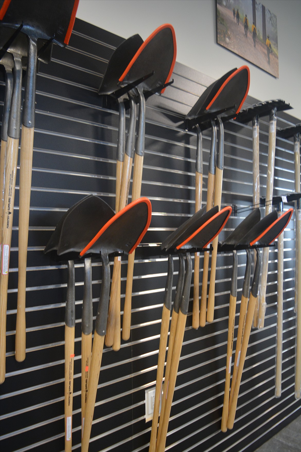 A wall of wildland firefighting equipment lines the retail portion of the Post Falls location for Wildfire Defense Systems.