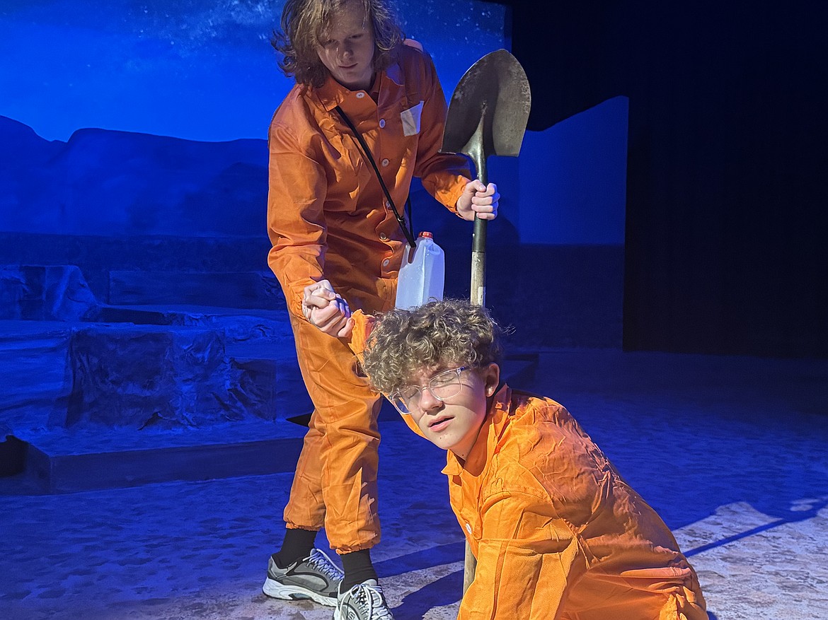 Stanley, played by Fenyx Colby, helps Zero, played by Daniel Cole, out of a hole in a Wolfpack Theatre Company production of "Holes" coming to Glacier High School Sept. 30 and Oct. 1 and 2. (Courtesy photo)