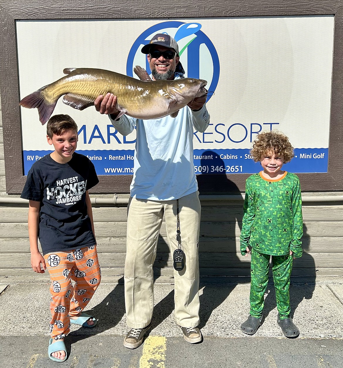 Jashua Sveum caught this 19.5 pound channel catfish on the face of the sand dunes while fishing for bluegill. He brough the fish in to be weighted, then took it back out to be released.