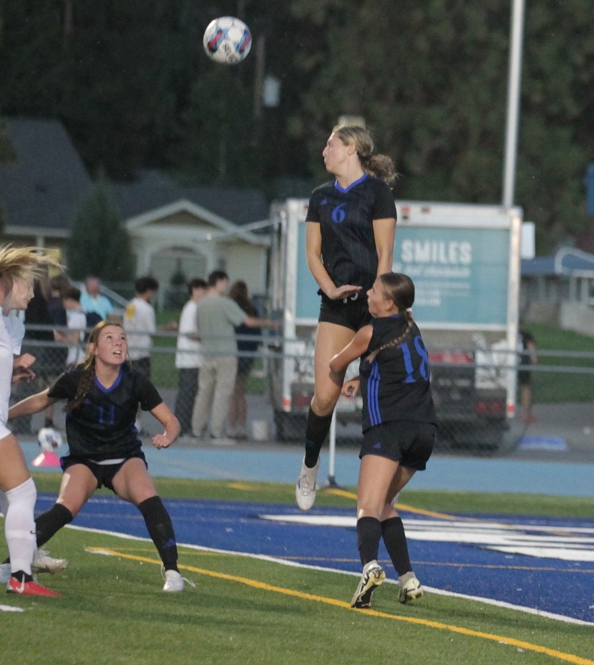 JASON ELLIOTT/Press
Coeur d'Alene junior forward Gianna Callari (6) attempts to play the ball in the air as teammate Izzy Grimmett (11) and Jersey Larson (18) get into position during the first half of Tuesday's Inland Empire League match at Viking Field.