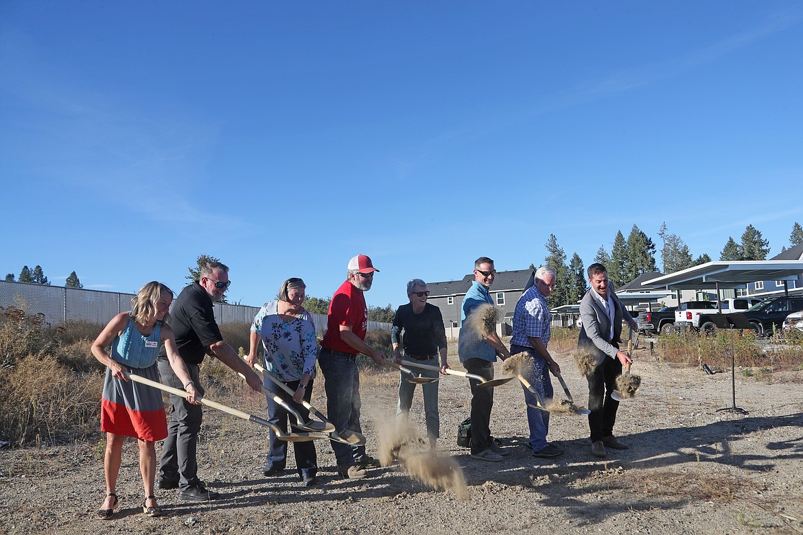 Katie Cox, Kaniksu Land Trust director; Ben McGrann, KLT Community Housing Trust board; contractor Bill Daum of Daum Construction, Susie Kubiak of the Equinox Foundation, Chrystle Horvath, Bonner Community Housing Authority, Priest River Mayor Jeff Connolly and Bart Cochran of LEAP Housing take part in a ceremonial groundbreaking of the Potlatch Loop project on Tuesday.