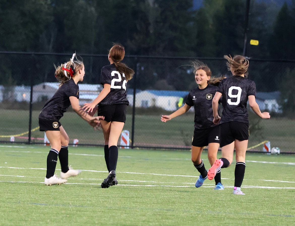 Courtesy photo
The Sting Soccer Club 2013 Girls Academy team played a friendly match against the Sandpoint Strikers last weekend in Ponderay. The Sting won 1-0 with a goal from Kyal Carlson. Pictured are Nora Schock, Kyal Carlson, Felicity Miller and Peyton Cantrell of the Sting celebrating after the goal.