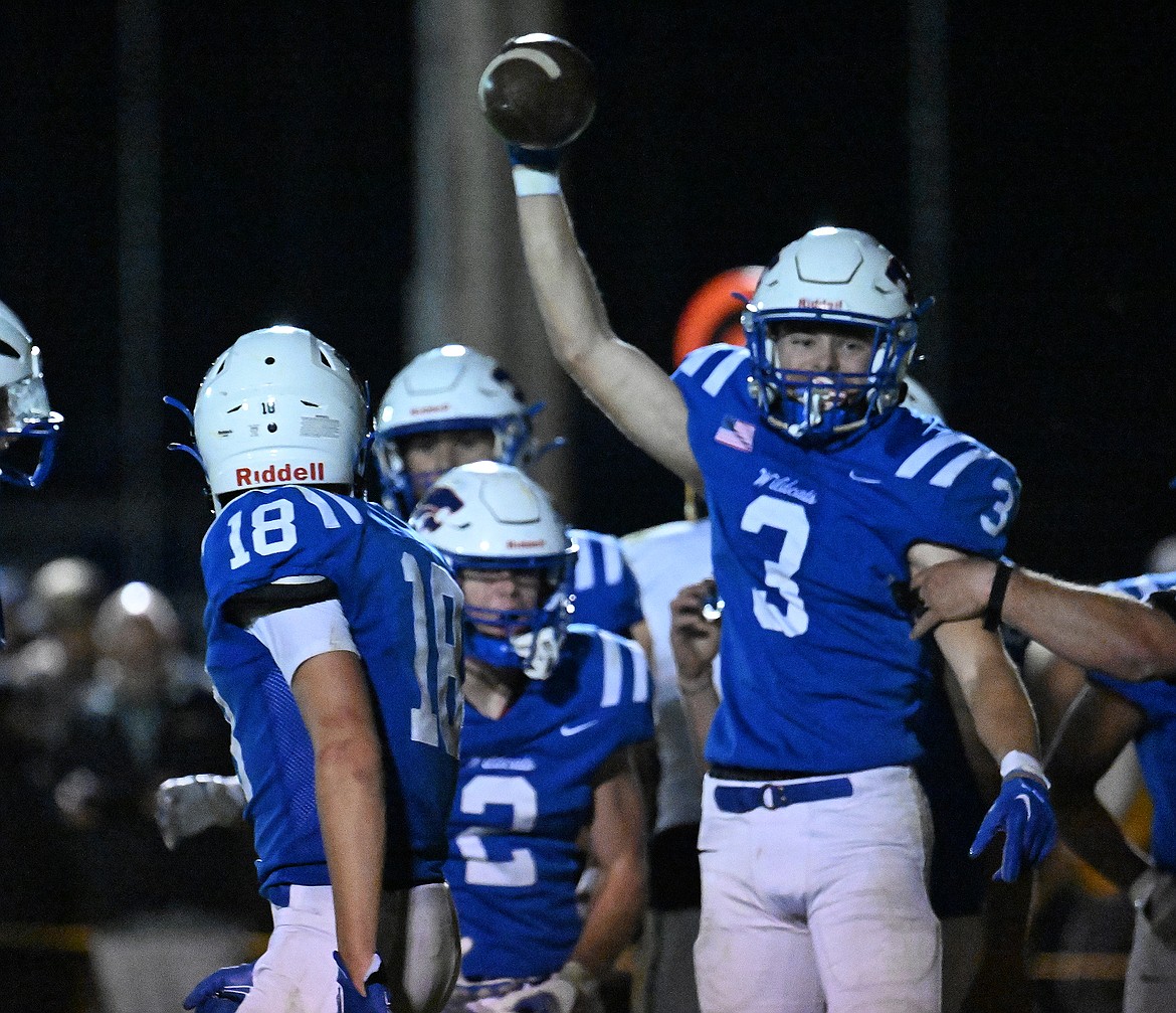 Cooper Ross holds up the football after making an interception against Whitefish to quash any hopes of a Bulldog comeback against the Wildcats.