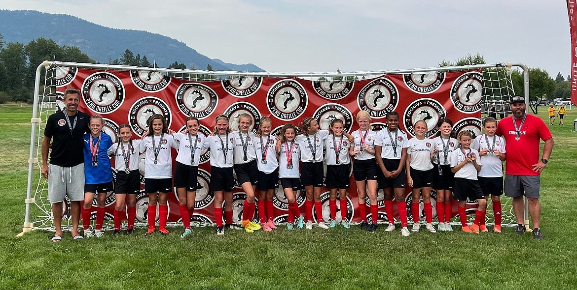 The 2013 Sandpoint Strikers (black) girls' soccer team finished runner-up in the Silver Division of the Pend Oreille Cup. From left are coach Adam Tajan, Presley Powell, Jayla Hatfield, Hannah Totland, Addison Sweeney, Halle Anderson, Scarlett Whitehouse, Sylvia Nees, Finley Williams, Nina Tajan, Claire LeBaron, Harper Mangano, Brooklyn Windju, Brielle Monk, Kate Hill, Maci Brandtner, Nonalina Ribeiro and coach Luke Anderson.