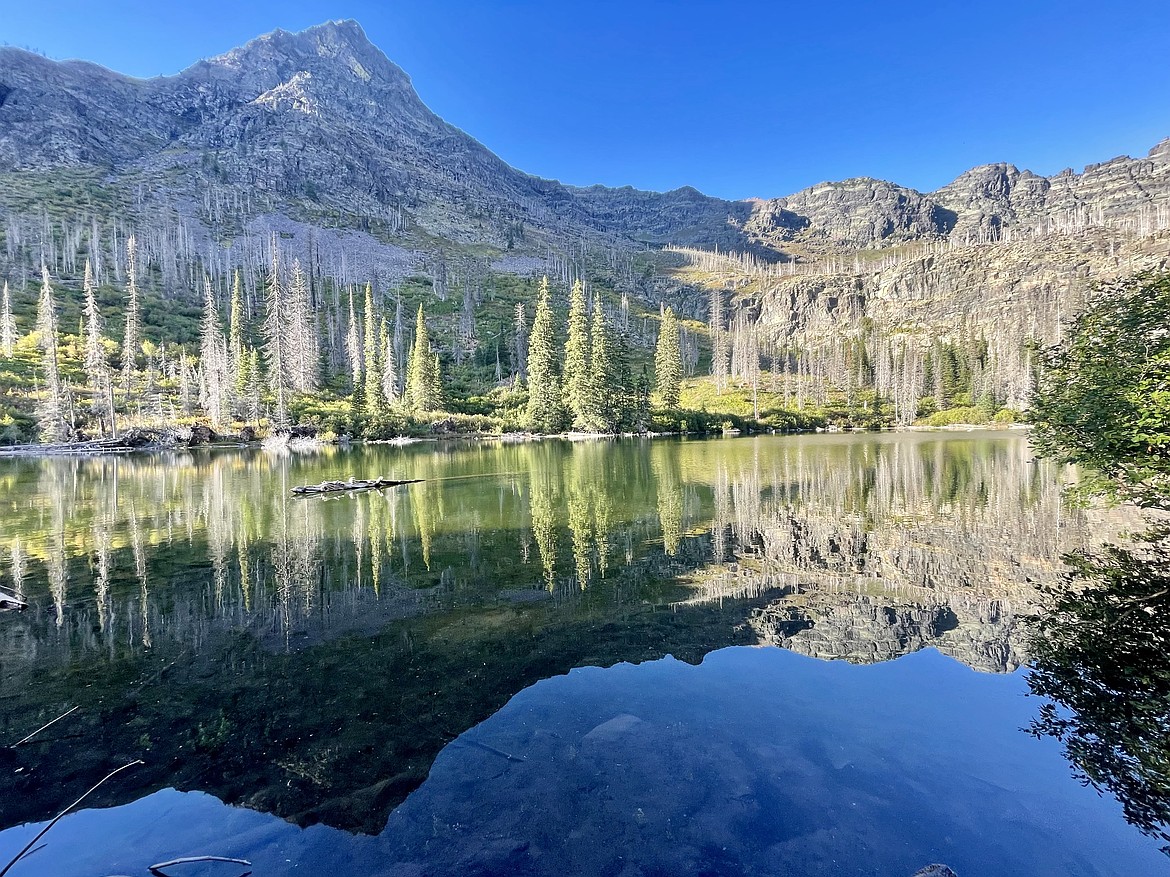 Mount Brown's ridge is reflected in Synder Lake in Glacier National Park on Saturday, Sept. 21, 2024. (Matt Baldwin/Daily Inter Lake)