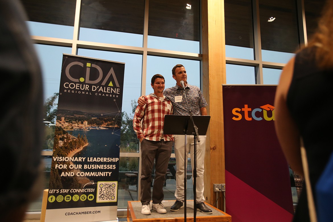 Lakes Middle School math teacher and 2024 Coeur d'Alene School District Teacher of the Year Marcus Ross, left, is introduced by Assistant Principal Aaron Drake during the Coeur d'Alene Chamber's New Educators Reception held Wednesday evening at North Idaho College.