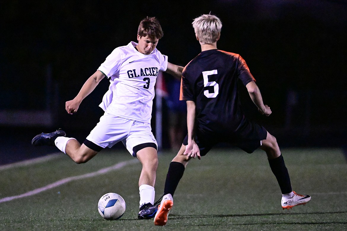 Glacier's Elias Holly (3) centers a ball in the first half against Flathead at Legends Stadium on Thursday, Sept. 26. (Casey Kreider/Daily Inter Lake)