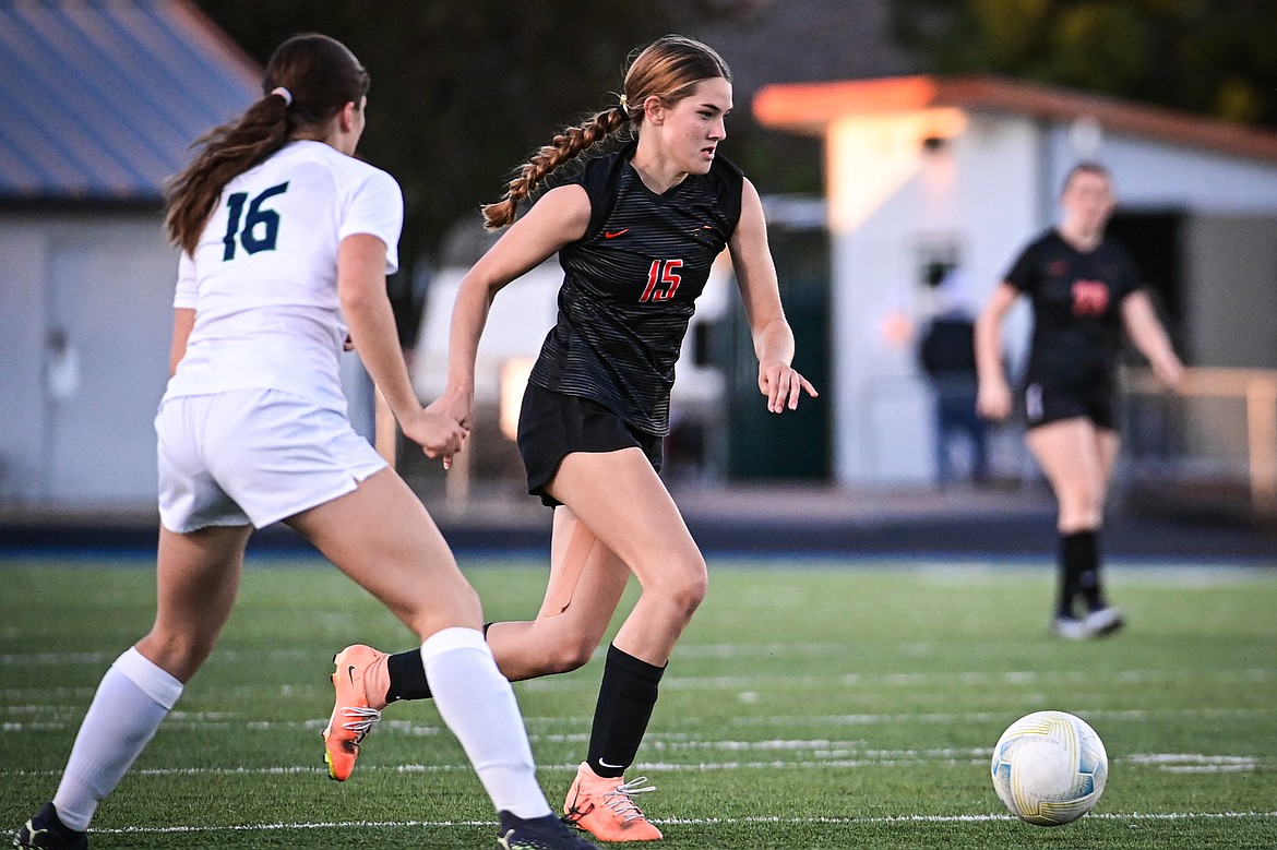 Flathead's Adeline Schneider (15) pushes the ball upfield in the first half against Glacier at Legends Stadium on Thursday, Sept. 26. (Casey Kreider/Daily Inter Lake)