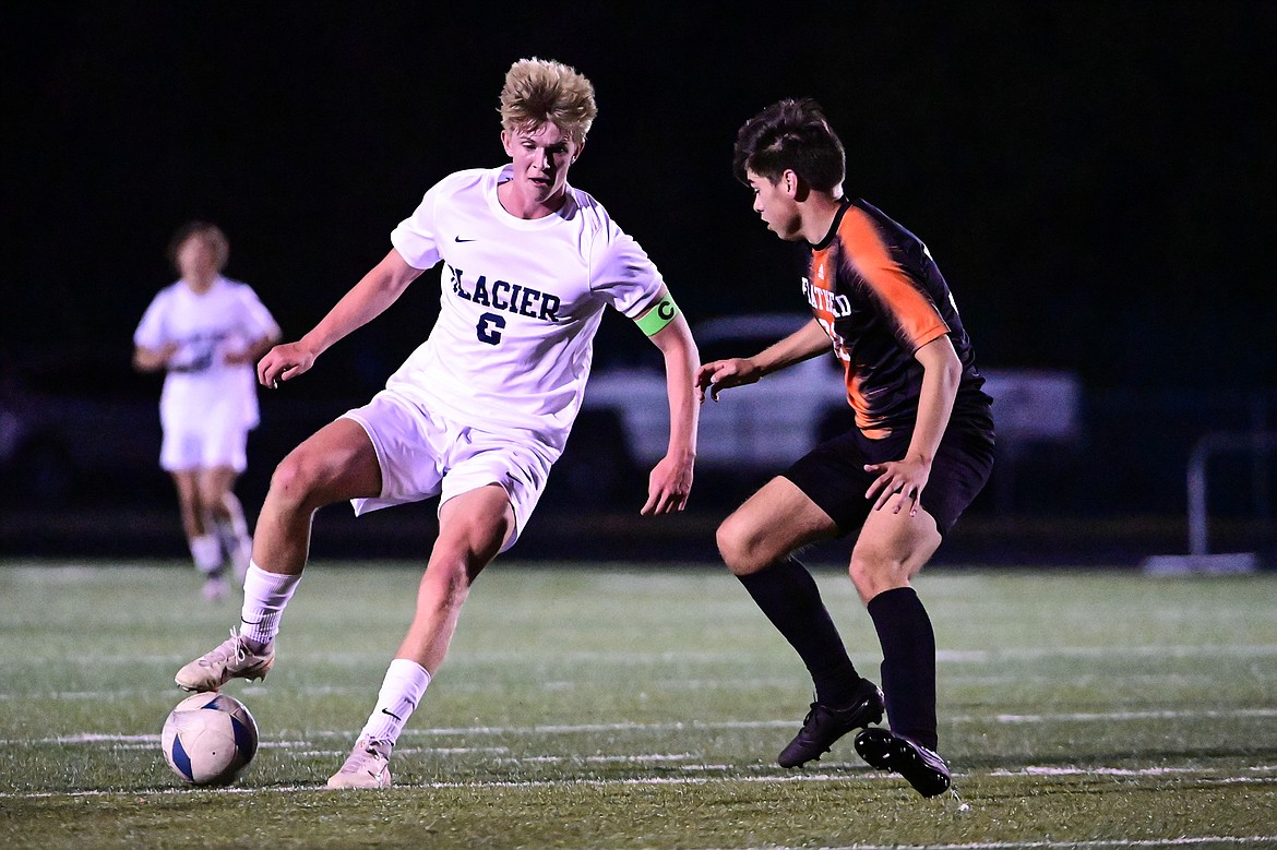 Glacier's Liam Ells (6) pushes the ball upfield in the first half against Flathead at Legends Stadium on Thursday, Sept. 26. (Casey Kreider/Daily Inter Lake)