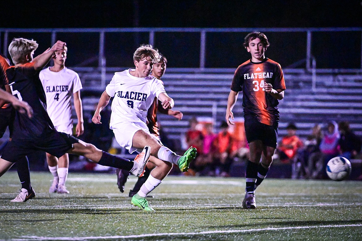 Glacier's AJ Zlogar (9) scores a goal in the first half against Flathead at Legends Stadium on Thursday, Sept. 26. (Casey Kreider/Daily Inter Lake)